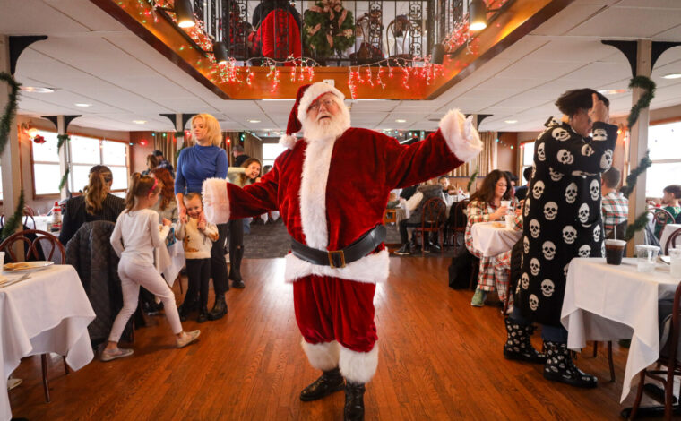 Santa aboard the riverboat cruise for holiday pajama event.