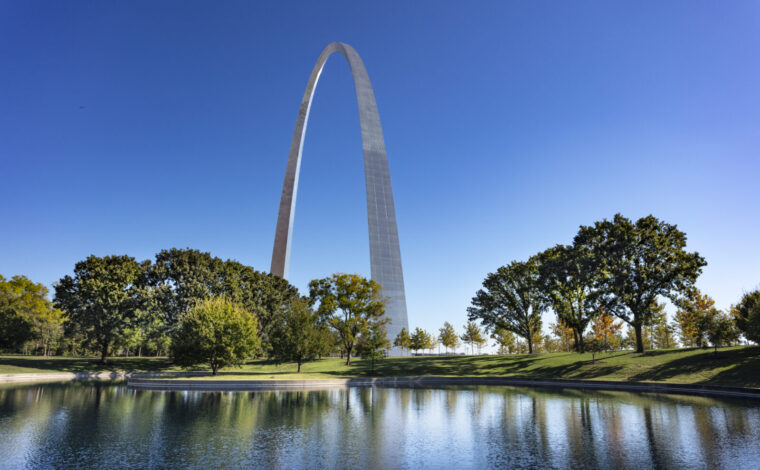 Wide shot of the Gateway Arch with the south reflection pond in foreground.